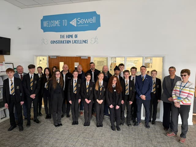 A group of students and employer representatives gathered at Sewell Construction